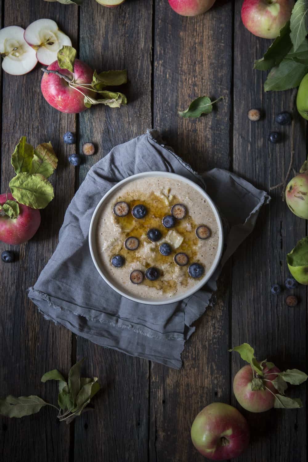 vegan oat bran porridge with apple and blueberries