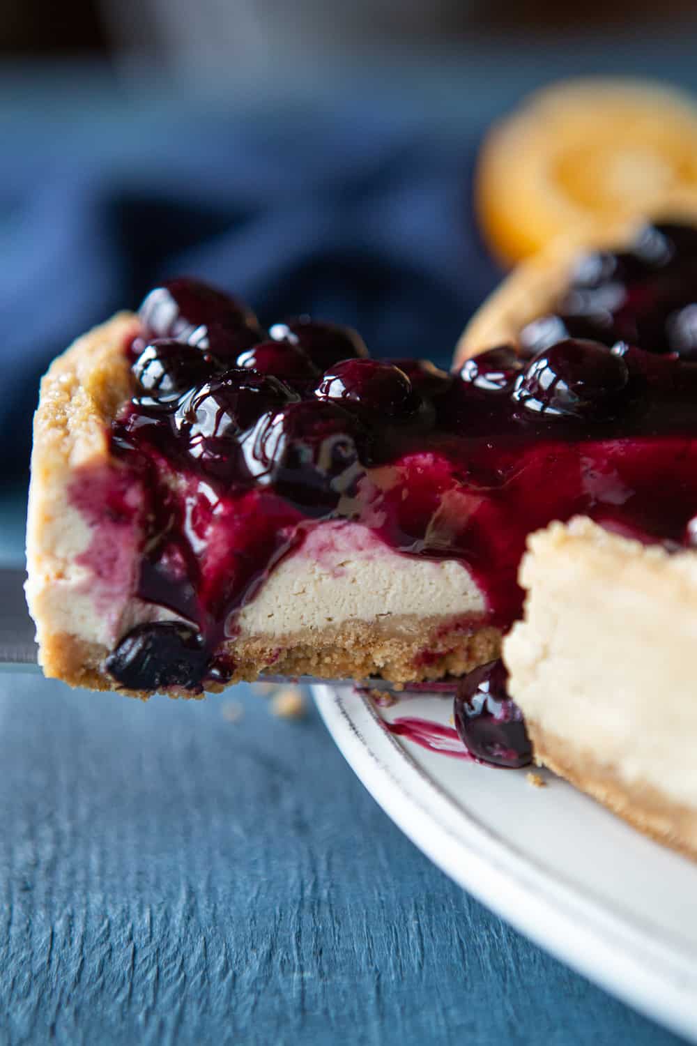 Baked Vegan Blueberry Cheesecake with slice being cut out