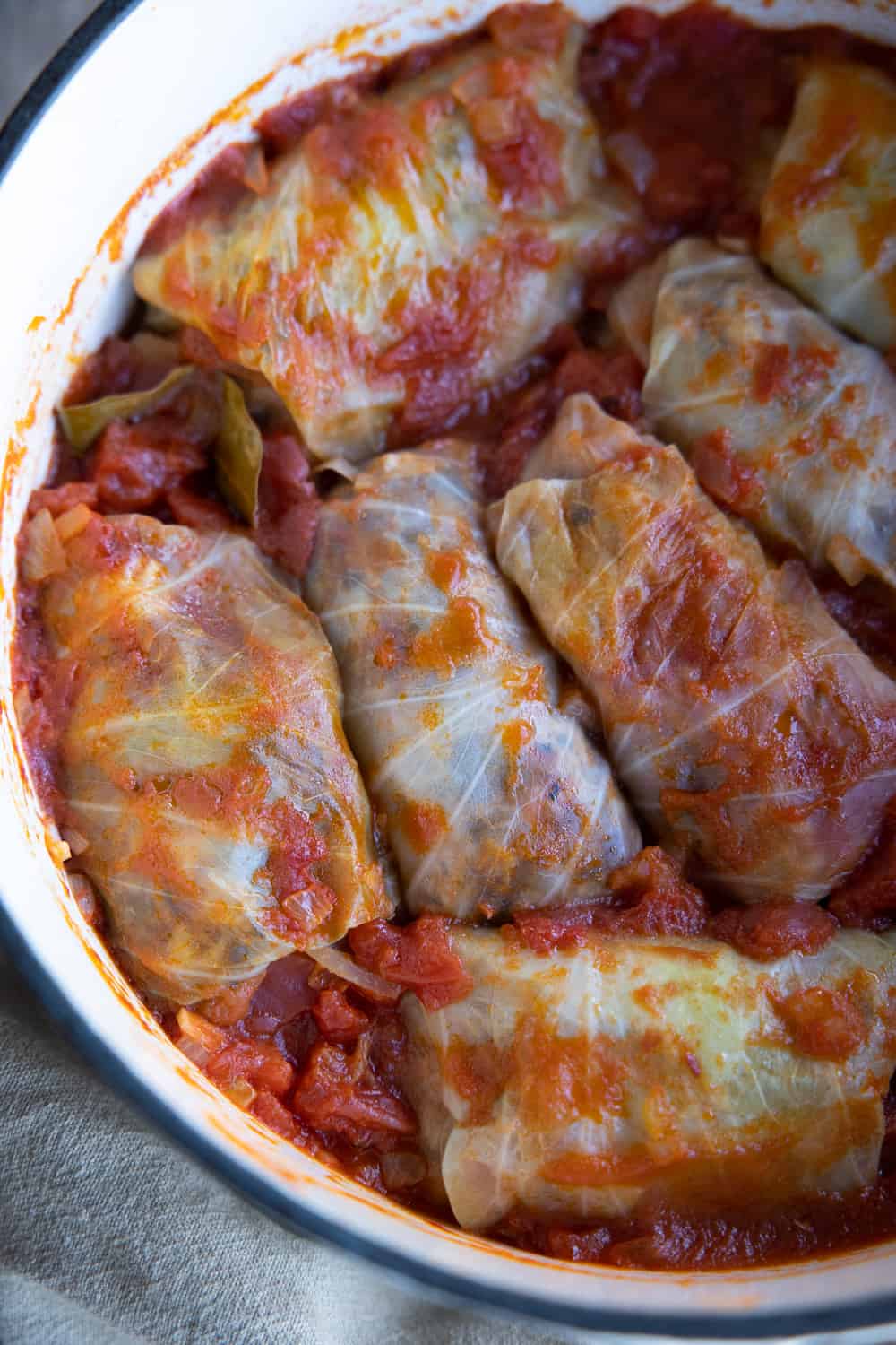 Cabbage rolls shot from above in cast iron pot.