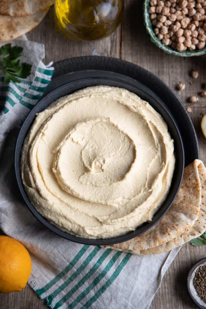 How to Make Hummus From Scratch Using Dried Chickpeas. Hummus from above in a bowl.