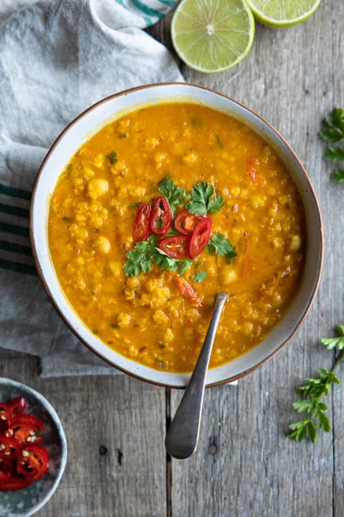 Red lentil soup from overhead in a bowl.