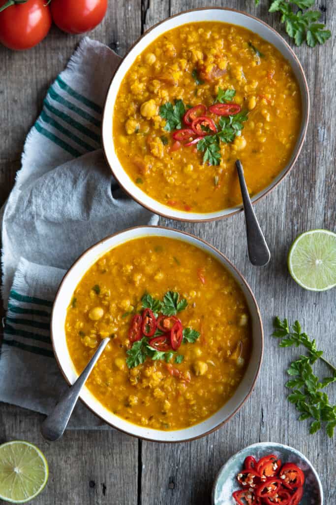 Red lentil soup served with two bowls.