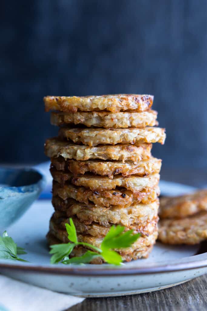 Hash browns stacked one on top of the other. 