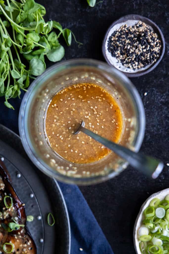 Sesame Miso Dressing in a mason jar.