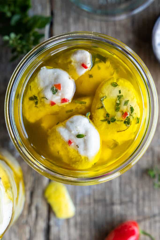 Marinated Vegan Bocconcini close up in jar.