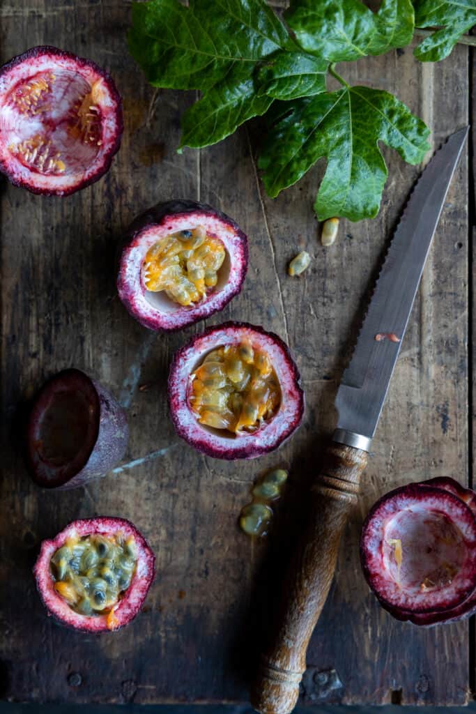 Passionfruits cut with a knife.