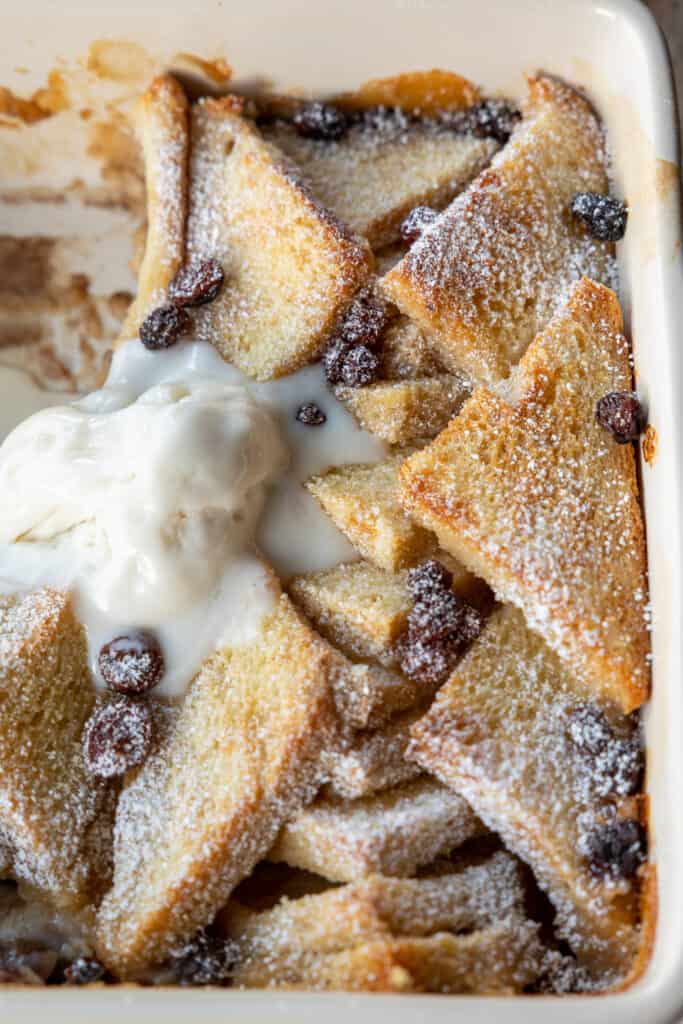 Close up of vegan bread pudding with melted ice cream.