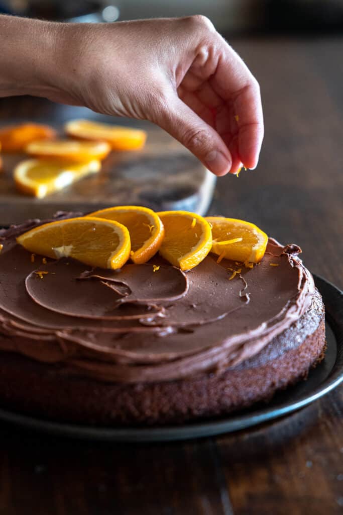 Adding zest to a whole gluten free vegan chocolate orange cake.