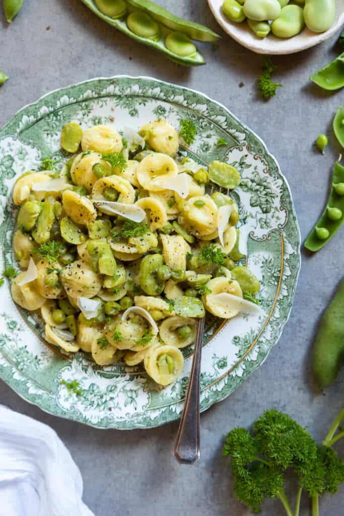 Fava bean pasta on a plate from above. 