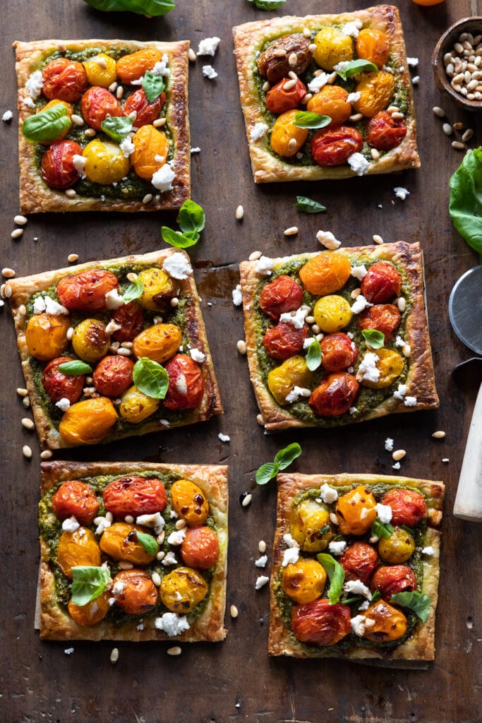 Vegan puff pastry pesto and tomato tarts shot from above.