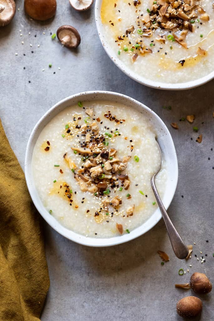 Vegan rice porridge in a bowl with a spoon.